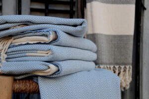 white and blue striped beach towels