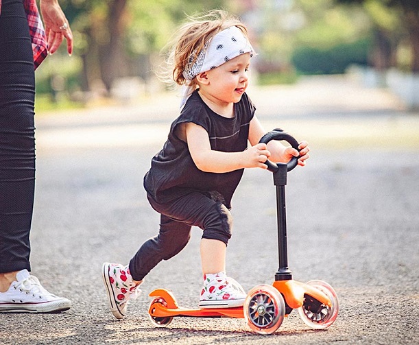 little girl on her scooter