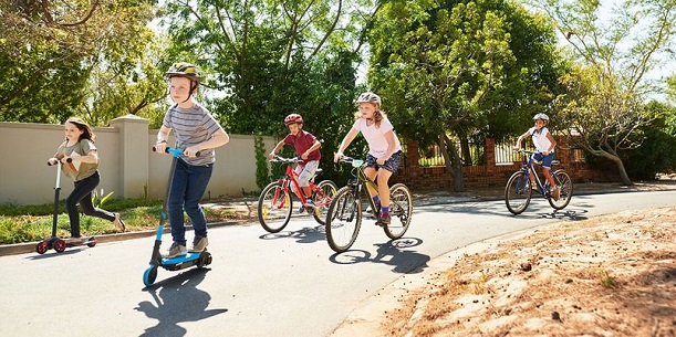 kids on scooters and bikes