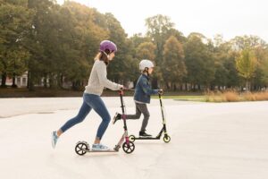 two kids on scooters