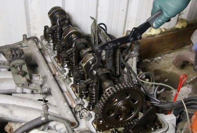 This arrangement means an engine with one cam per head. So if it is a 4 or 6-cylinder engine, it will have one cam; if it is a V-6 or V-8, it will have two cams. The valves are pressed down by the actuated rocker arms by the cam that open them. Then the springs return the valves to their closed positions very quickly. If the springs were not strong enough, the valves might come away from the rocker arms and snap back. That’s something to avoid because it can cause significant wear and tear on the cams.