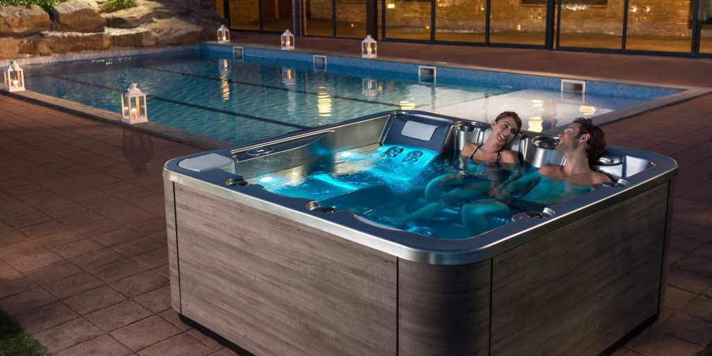 Soaking in a hot tub has got to be one of the best ways to wind up after a long day. Moreover, it’s a valuable home addition that offers year-round relaxation right in the comfort of your own backyard. Unlike standard bathtubs, these tubs, also known as spa tubs, have a design to accommodate multiple people at once.